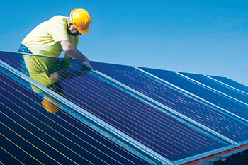 Technician working on solar panels